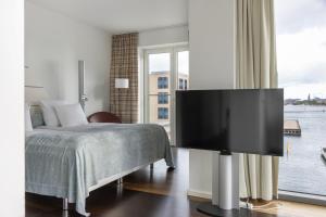 TV a/nebo společenská místnost v ubytování Copenhagen Island Hotel