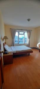Postel nebo postele na pokoji v ubytování Hotel Sherwi Hyul