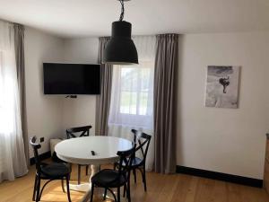 TV a/nebo společenská místnost v ubytování Tauernhaus Appartment