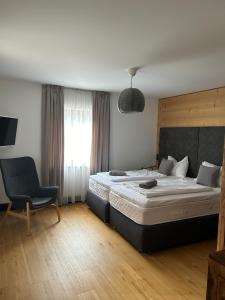 Postel nebo postele na pokoji v ubytování Tauernhaus Appartment