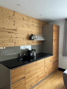 Kuchyň nebo kuchyňský kout v ubytování Tauernhaus Appartment