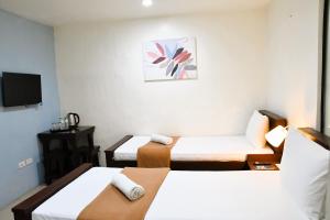 Postel nebo postele na pokoji v ubytování Arzo Hotel Makati