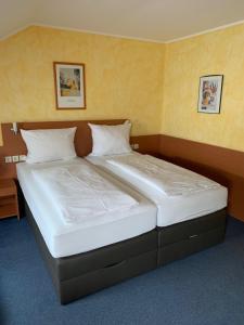 Postel nebo postele na pokoji v ubytování Hotel Nord