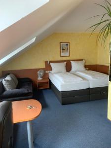 Postel nebo postele na pokoji v ubytování Hotel Nord