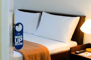 Postel nebo postele na pokoji v ubytování Arzo Hotel Makati