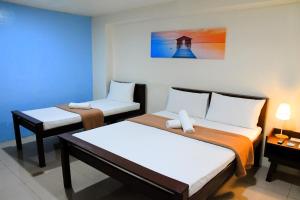 Postel nebo postele na pokoji v ubytování Arzo Hotel Makati