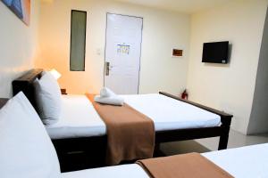 Postel nebo postele na pokoji v ubytování Arzo Hotel Makati