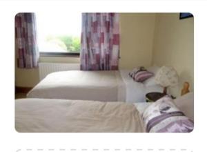 Katil atau katil-katil dalam bilik di Meadow View