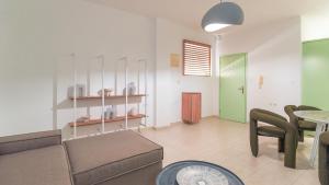 a living room with a couch and a table at Paleochora Central Apartments in Palaiochóra