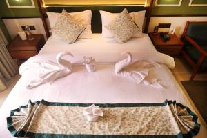 Hotel Sonar Bangla Puri客房内的一张或多张床位