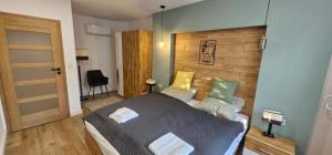 A bed or beds in a room at Péterfia Boutique Apartments