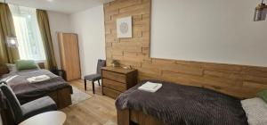 A bed or beds in a room at Péterfia Boutique Apartments