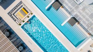 an overhead view of a swimming pool on a cruise ship at Quartano Suites by Heliessa, Adults Only in Naousa