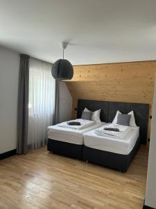 Postel nebo postele na pokoji v ubytování Tauernhaus Appartment