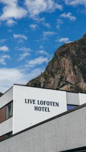 a sign that reads liveormon hotel on the side of a building at Live Lofoten Hotel in Stamsund