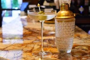 a drink in a glass next to a bottle on a counter at The Swiftwater in Swiftwater