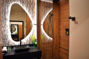a bathroom with a sink and a mirror at The Swiftwater in Swiftwater