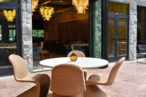 a white table and chairs on a patio at The Swiftwater in Swiftwater