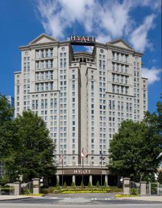 a hotel building with a sign on top of it at Grand Hyatt Atlanta in Buckhead in Atlanta