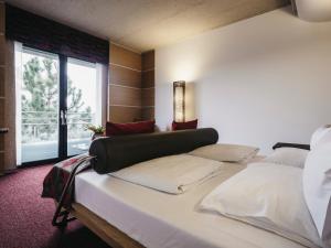 Voodi või voodid majutusasutuse Linsberg Asia Hotel, Spa & Therme - Adults Only toas