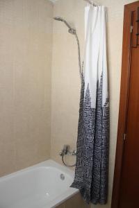 a bathroom with a shower curtain with a city at Fuente Lebana Labradores in Facinas +59 photos