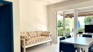a living room with a couch and a table at VILLETTA FRANCA in Numana
