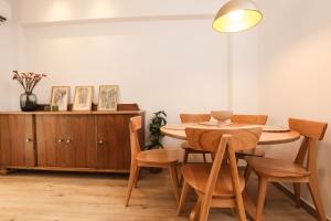 a dining room with a table and chairs at Casa Biondina, Corfu Town in Corfu Town +26 photos