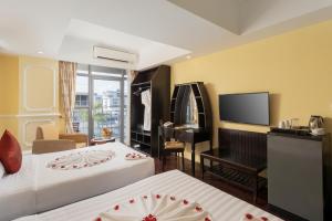 Postel nebo postele na pokoji v ubytování ARISON Hotel