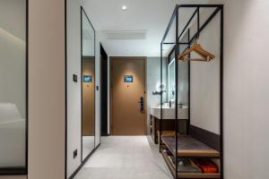 Katil atau katil-katil dalam bilik di Atour Hotel Suzhou New District Science and Technology City