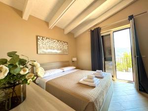 a bedroom with a bed with towels on it at Dolce Risveglio in Agerola