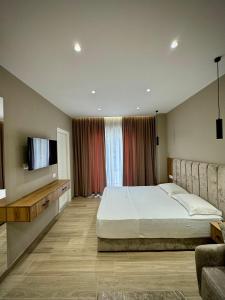 Postel nebo postele na pokoji v ubytování Hotel Vila Dedej