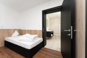 Posteľ alebo postele v izbe v ubytovaní A CASA Opal Appartements