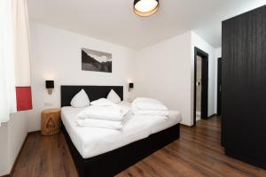 Posteľ alebo postele v izbe v ubytovaní A CASA Opal Appartements