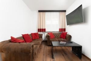 Televízia a/alebo spoločenská miestnosť v ubytovaní A CASA Opal Appartements