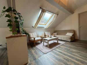 Posezení v ubytování L'Escapade Montagneuse