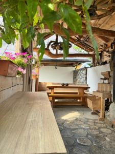 a wooden table in a room with a bench at U Młynorza Jacuzzi ogrodowe całoroczne in Suche
