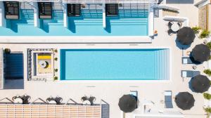an overhead view of a swimming pool on a building at Quartano Suites by Heliessa, Adults Only in Naousa
