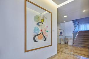 a large painting on a wall in a hallway at Hotel Joan Miró Museum in Palma de Mallorca
