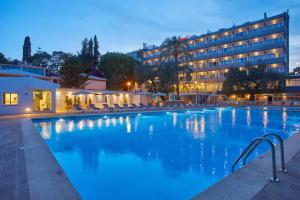a large swimming pool in front of a hotel at Hotel Joan Miró Museum in Palma de Mallorca