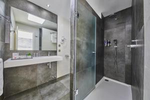 a bathroom with a shower and a sink at Hotel Joan Miró Museum in Palma de Mallorca