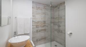 a bathroom with a glass shower and a sink at OurMadeira - Cottage do Mar, secluded in Arco da Calheta +14 photos