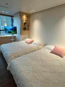Letto o letti in una camera di Hongdae sub 1min