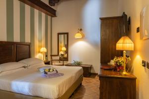 Postel nebo postele na pokoji v ubytování Al Castello Resort + 37 fotografií