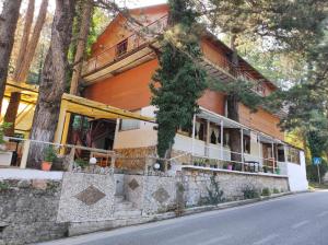 a building on the side of a street at Hotel Toni Llogora in Llogara