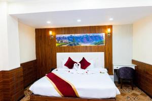 Voodi või voodid majutusasutuse Hotel Palazzo toas