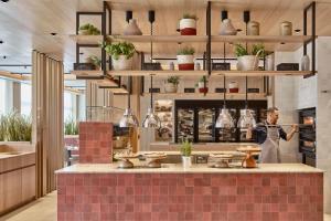 A kitchen or kitchenette at Falkensteiner Hotel & Spa Carinzia Superior