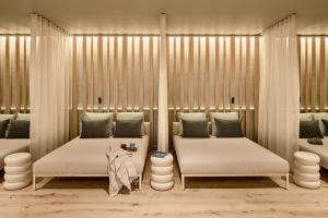 A bed or beds in a room at Falkensteiner Hotel & Spa Carinzia Superior