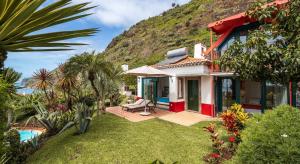 a villa with a view of the ocean at OurMadeira - Villa do Mar I, secluded in Arco da Calheta