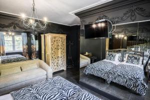 SAFARI HOUSE - Wisła tesisinde bir odada yatak veya yataklar