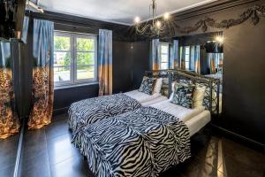 SAFARI HOUSE - Wisła tesisinde bir odada yatak veya yataklar